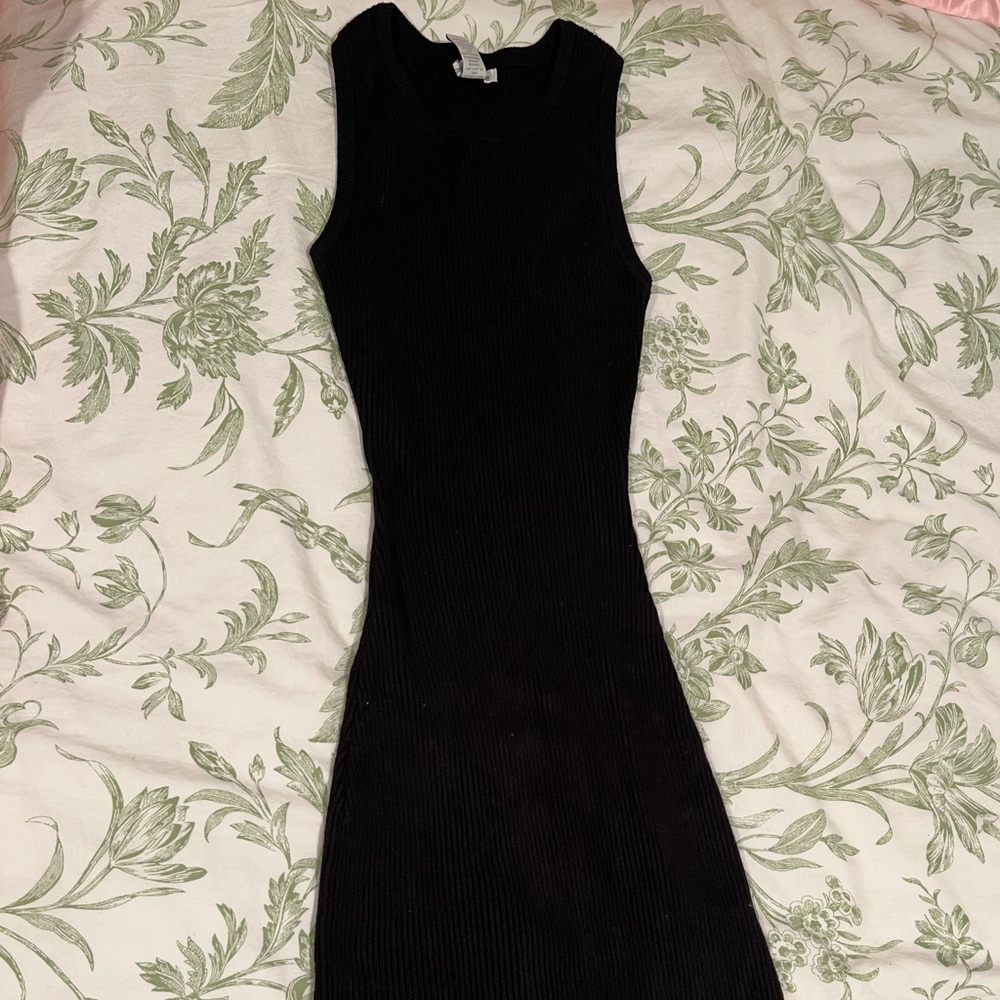 Black ribbed knit sleeveless dress with side slits